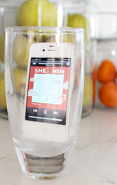 Put your phone in a glass to make the music loud enough to fill the room! Never guessed!