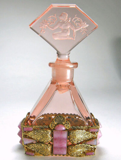 This all pink perfume bottle was made in Czechoslovakia in the 1920-30's era. The maker is Franz Josef Vater & Co and shown in their catalogue as 1931. The bottle is often confused with Hoffman bottle…