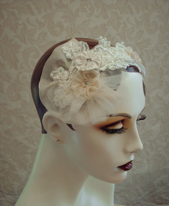 "I have handcrafted this headpiece from a beautiful ivory organza applique embellished with delicate metallic embroidery, shimmering champagne organza, and shimmer tulle, ivory faux pearls, AB rhinestones, AB sequins, and crystal beads."