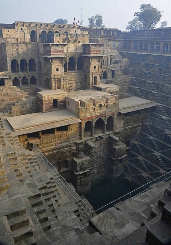 Chand Baori, a stepwell in the village Abhaneri near Jaipur, India. It was built in 9th century and has 3500 narrow steps, 13 stories and is 100 feet deep.