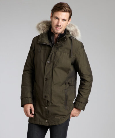 Color: Olive Heavy weight water resistant woven Snap removable, drawstring hood with fur trim; Origin: Canada Snap and button front Long sleeve with button tab and inner knit cuff Four pockets at fron…