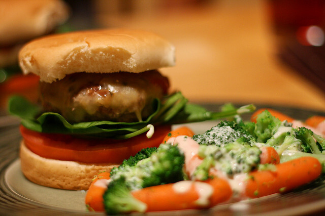 Burger w/ veggies and cheese sauce