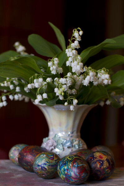 Photograph Easter eggs in front of Lily-of-the-valley flowers by Panayotis Pantzartzidis on 500px