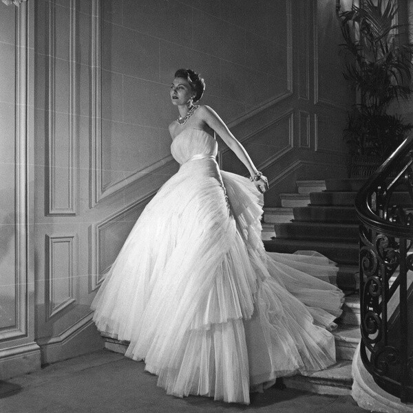 Christian Dior's evening gown named "Tuileries", photo by Willy Maywald on the staircase of Dior's salon, 1949