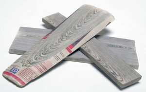 Mieke Meijer of Design Academy Eindhoven has set out to reinterpret the concept with the creation of the material NewspaperWood. Reversing the whole technique and concept, she set out to take stacks upon stacks of newspaper and through a gluing process was able to create a relatively robust material