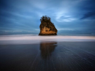 Picture of a rock formation off a beach in Japan