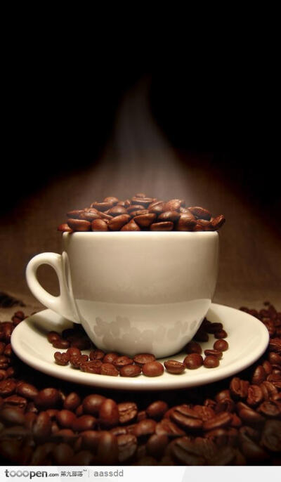 一堆咖啡豆和一杯咖啡杯生活百科图片素材