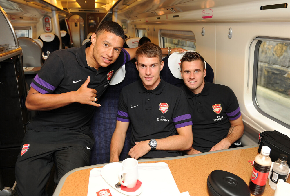 L-R Alex Oxlade-Chamberlain, Aaron Ramsey and Carl Jenkinson on the train home after the match at Anfield on September 2, 2012 in Liverpool, England