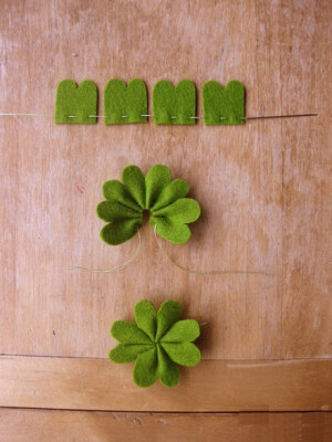   四叶草啊亲！不织布，剪出来抽紧！立体的，美！