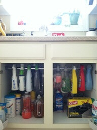 shower curtain rod to hold bottles under sink