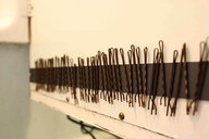 this is a magnet strip in the medicine cabinet for bobby pins to stick on. GENIUS