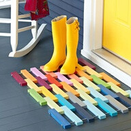 Porch mat made from multi-colored wooden strips