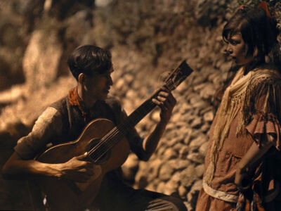 A man plays his guitar for a young girl in Granada, Spain, in this autochrome picture that appeared as part of a photo essay in the March 1929 issue of National Geographic. An early master of autochr…