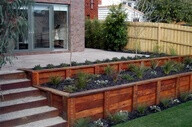 Beautifying Your Landscape Using Wooden Retaining Walls: Wooden Retaining Walls Ideas...also like the gravel filled stairs