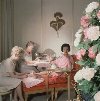 Gloria Vanderbilt receiving manicure and pedicure at the House of Revlon by Horst P. Horst. ca. 1961.