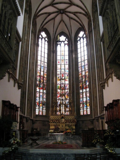 Love the arches and trefoil shapes in the stained glass windows.