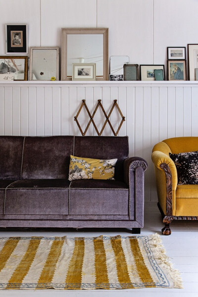 great use of color in the living room lilac + mustard