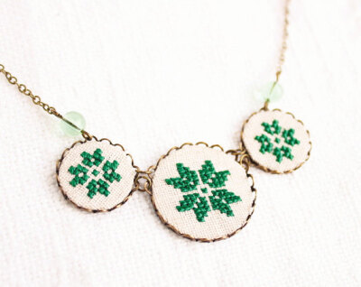 Geometrical green necklace with three cross stitch ethnic flower ornaments in bronze - gift for her