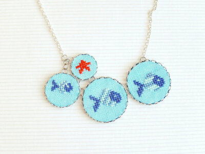 Nautical necklace with fishes and bright red starfish