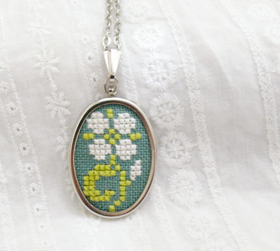 Hand embroidered necklace light flower on green