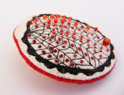 Beaded modern brooch red white black