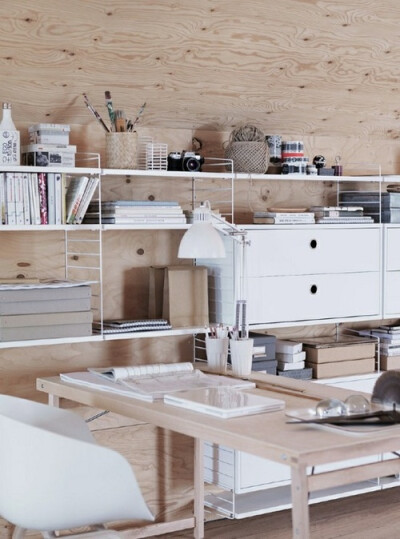 Add Some Warmth: 12 Plywood Interiors \\\ Photo by Petra Bindel. Plywood is the perfect medium for an office; this one is outfitted with units by String Shelving.