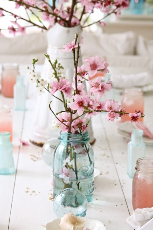 Blooming branches are beautiful! Also love the use of mason jars/old pitchers to hold them. Mason jars as glasses are great too!