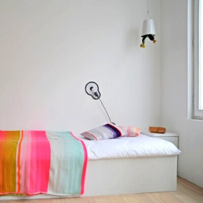 12 White Rooms with Pops of Color: This is a bedroom in a concept guest house in Ghent, Belgium, above the gallery Sofie Lachaert, designed by Droog Design. It allows customers to experience Droog’s …