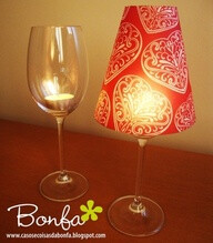 Cheap wine glass + tea light candle + paper cup with bottom cut out. great idea for table decor.