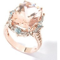 Peach Morganite and Blue Zircon with diamonds and rose gold. A Zircon is a naturally occuring stone and not to be mistaken for Zirconia which is man made,