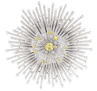 Chanel “Soleil” brooch in 18-karat white gold set with 1765 brilliant-cut diamonds for a total weight of 8.7 carats and 16 brilliant-cut yellow diamonds for a total weight of 1.5 carat.