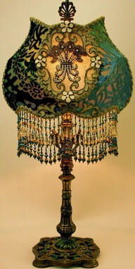 What a lampshade. Love the shape and the bead work and jewels.