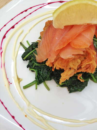 House smoked salmon on a potato croquette with wilted spinach &amp; citrus crème fraiche