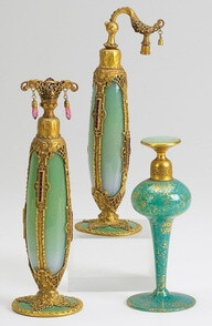 A collection of vintage art glass perfume atomizers, glass by Stueben for De Vilbess Perfumizers Company, circa 1920s.