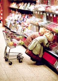 A miniature cart and two children who look as if they just stepped out of a Hanna Andersson catalog—adorably absorbed in picking out their favourite candies. Love it!