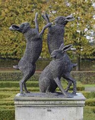 A bronze group of boxing hares Wong Lun Hing (b. 1921), second half 20th century On a composition stone pedestal overall high 158 cm.: pedestal 39 cm. high x 95 cm. wide x 95 cm. deep (2)