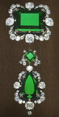 the rectangular stone alone (one on top) is a 42 carat emerald