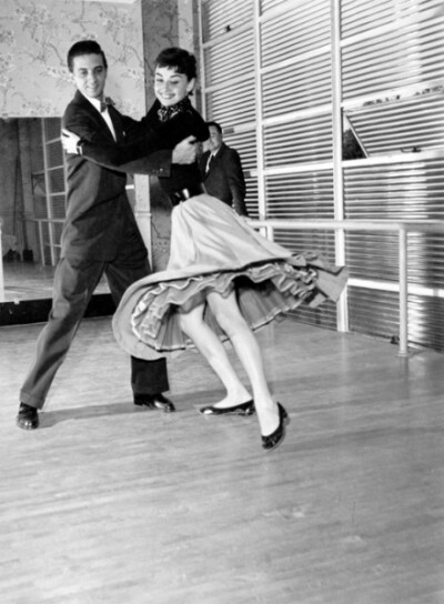 Audrey Hepburn and a dancing partner photographed by Earl Theisen, 1954.