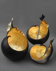 Kay Lynne Sattler makes pit fired coil pots with gold leaf. Inspired by the volcanic forms of her home in Hawaii.