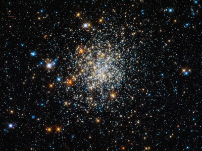 I'm Coming Apart - Credit: ESA/Hubble & NASA Tuesday, Feb. 5, 2013: NGC 411, seen here, looks like a globular cluster, but appearances may deceive the viewer.