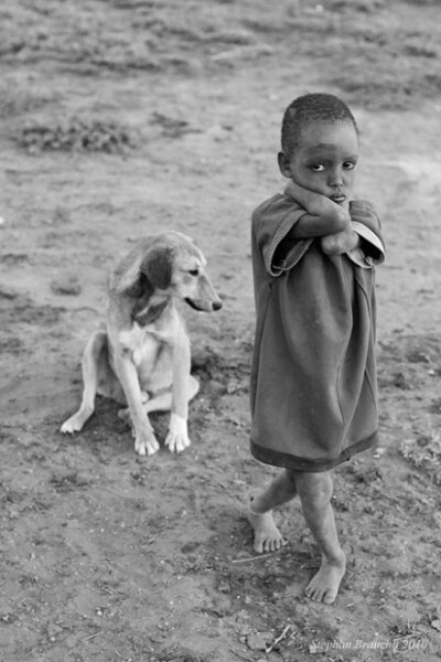 PHOTO: MASAI BOY WITH DOG | PHOTOGRAPHER: STEPHAN BRAUCHLI