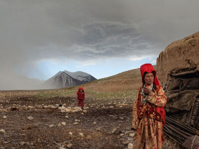 Picture of two Kyrgyz nomad girls outside their mud hut in Afghanistan After a hailstorm, nomadic Kyrgyz girls venture outside their mud hut beside the Aksu River in a remote part of Afghanistan. The …