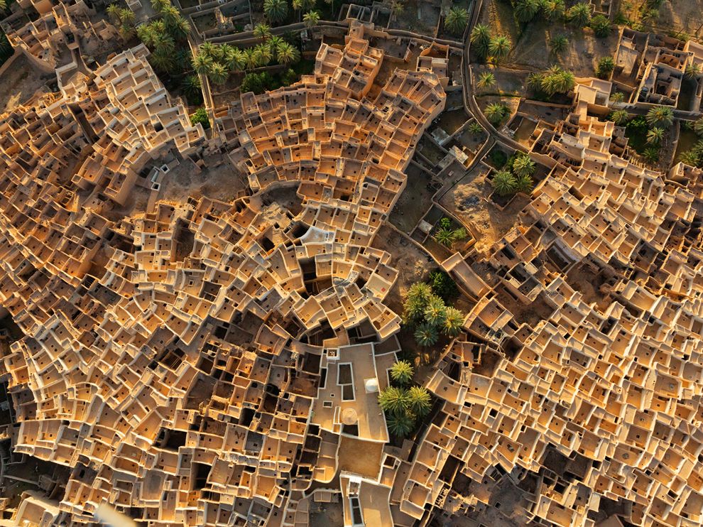 Picture of Ghadames, a pre-Roman oasis town in the Sahara Tight clusters of traditional mud-brick-and-palm houses have stood for centuries in Ghadames, a pre-Roman oasis town in the Sahara. Rooftop walkways allowed women to move freely, concealed from men’s view.