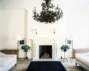 A tole chandelier suspended above a symmetrical seating arrangement, Jo Malone London