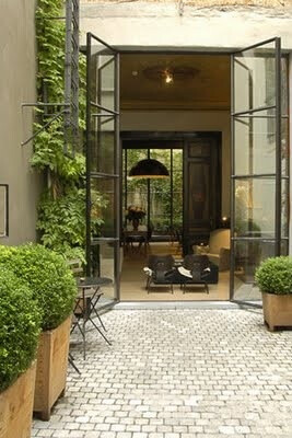 Doors opening onto outdoor courtyard