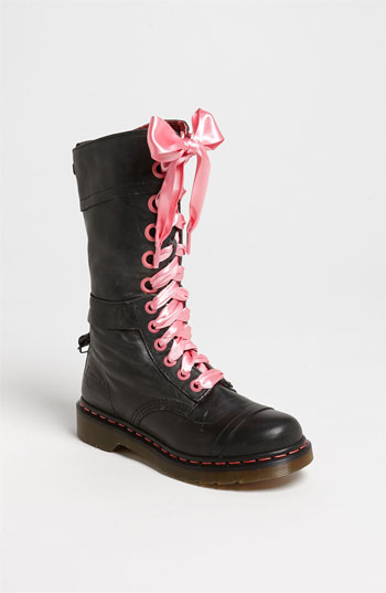 An offbeat print lining defines a cuffed boot with quirky ribbon laces softening the military-inspired look. The waxed finish is designed to fade over time and enhance the vintage aesthetic. Removable insole. Approx. heel height: 1". Approx. boot shaft height: cuffed 7 1/2"; uncuffed 11"; 16" calf c