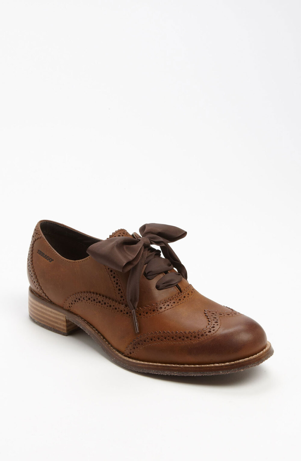 Ladylike laces flirt with the boyish broguing of a charming wingtip oxford. Leather upper and lining/rubber sole. By Sebago; imported.