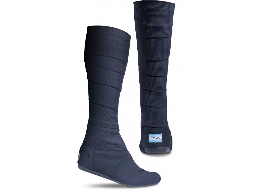 Wrap them up. Wrap them down. TOMS Wrap Boots are a stylish way to wear One for One. TOMS Wrap Boots are versatile and ultra comfortable, providing styles for any occasion, casual to formal. And they're vegan-friendly, TOMS Wrap Boots in navy.