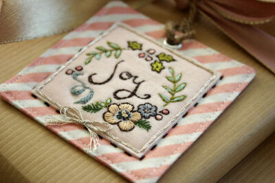 close up, handmade embroidered "Joy" tag by nanaCompany, J_2752