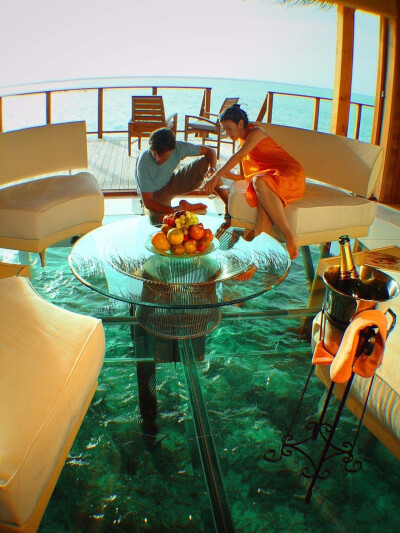 In this glass floor ocean cottage in the Maldives.